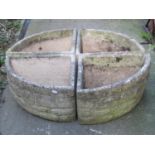 A reclaimed four sectional garden planter forming a circle, with mock stone wall effect, stamped