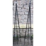 A pair of contemporary coated light steel obelisks, 136cm high