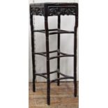 A late 19th century Chinese hardwood stand, square cut with carved and pierced borders and simulated