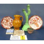 An unusual green glazed studio pottery twin branch candelabra with moulded seal mark to base, 41cm