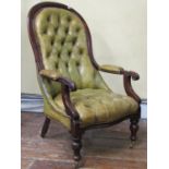 A Victorian drawing room chair with carved and moulded show-wood frame with scrolled arms on