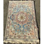 Persian Tabriz type silk blend rug with central Islamic floral medallion upon a sky blue ground, 130