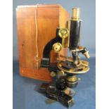 Mahogany cased Carl Zeiss ebonised and brass microscope with various lenses