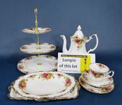 A collection of Royal Albert Old Country Roses pattern wares comprising a three tier cake stand, a