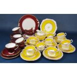 A collection of Wetley China yellow and gilt tea wares including milk jug, slop bowl, pair of cake