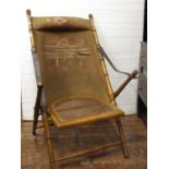 An Edwardian folding garden or conservatory chair, with turned beechwood frame, cane panelled seat