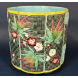 A 19th century majolica jardinière with relief moulded and painted Japanese style floral and leaf