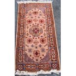 Late 19th century full pile Ardabil rug with floral medallions upon a fawn ground, 180 x 90cm