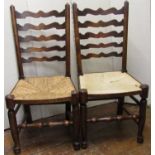 A pair of country made ladderback dining chairs with rush seats, on turned supports