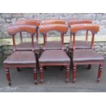A set of six Victorian mahogany dining chairs with curved and moulded bar backs over upholstered