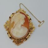 Vintage 9ct cameo brooch depicting a lady within ornate frame, maker 'A&Co', Birmingham 1967, 6.