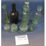 A collection of 19th century excavated bottles including codd examples, inks, sauce bottles, etc
