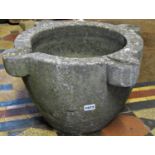 A large reclaimed mortar with shaped lugs, 30 cm high x 40 cm in diameter approximately (cracked)