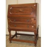 An early 20th century oak freestanding hall robe, with applied mouldings, enclosed by a full