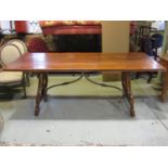 A contemporary reproduction Spanish refectory dining table with rectangular planked top, moulded