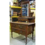 A Victorian walnut dressing table, the raised swing mirror with rectangular bevelled edge plate