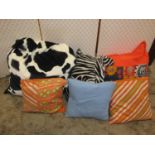 A large quantity of contemporary scatter cushions varying size colourway and printed designs