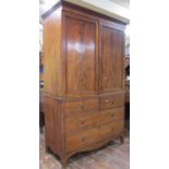 A Georgian mahogany linen press, the lower section enclosed by two short drawers, the upper