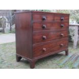 A 19th century mahogany bedroom chest of two short over three long graduated drawers with turned