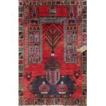 Persian old Baluchi village rug with architectural decoration upon deep red ground, 130 x 85cm