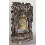 A Chinese temple gong, hardwood carved figural gong bearers with fine silver metal decoration, 46 cm