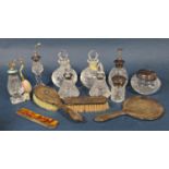 A mixed collection of silver dressing items to include a hand mirror, two brushes and silver