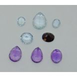 Quantity of loose gemstones comprising three amethysts, four blue spinels and a garnet (8)