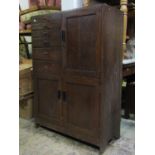 An early 20th century oak dentist/medical cabinet freestanding and enclosed by three drawers and a