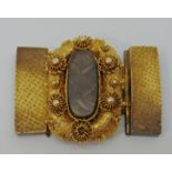 Early Victorian yellow metal mourning clasp with cannetille detail and central glazed compartment