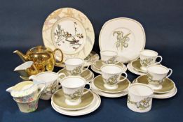 A collection of Wedgwood Susie Cooper design Iris pattern teawares comprising cake plate, milk