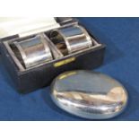 Silver 'pebble' pill box with sprung hinged lid, 9 cm long, together with a good pair of cast silver