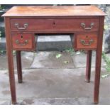 A Georgian mahogany lowboy fitted with three frieze drawers, raised on square tapered supports, 74cm