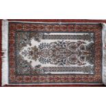 Small Persian tree of life silk blend prayer mat size rug, with typical foliate decoration upon an