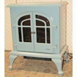 A Warmlite log effect electric fire heater in light blue colourway, model number WL46001