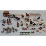 Collection of vintage lead painted farm animals and model farm accessories by Britains, Timpo etc