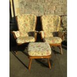 An Ercol Windsor two seat cottage sofa with stained beechwood frame and loose cushions together with