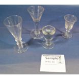 A collection of thirteen Georgian drinking glasses including illusion glasses, stemmed wine glasses,