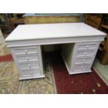 A three sectional twin pedestal desk with painted finish, each pedestal fitted with four long