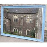 A large contemporary antique style wall mirror of rectangular form with bevelled edge plate within a