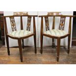 Pair of inlaid Edwardian mahogany corner chairs with carved and pierced splats, upholstered seat and