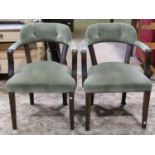 A pair of Georgian style library chairs with moulded frames, upholstered seats and button back rails