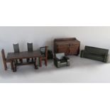 A set of 1930s style dolls house furniture with an oak utility style sideboard, dining table and