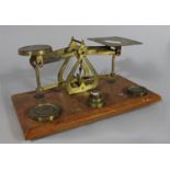 A brass set of stationery scales and weights