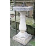 A reclaimed two sectional sundial, with square stepped base and vase shaped pedestal supporting an