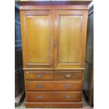 A late Victorian walnut linen press, the lower section enclosed by two short drawers, the upper