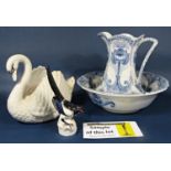 A pair of USSR models of magpies, 25cm approx, a white glazed model of an elephant, 30cm tall