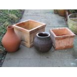 A square terracotta garden planter with tree moulded detail, 42cm square x 30cm high, together