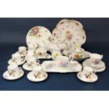 A collection of continental ceramics in the Meissen manner, all with painted floral decoration