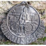 An antique lead Birmingham circular fire insurance plaque, with raised relief of a fireman with