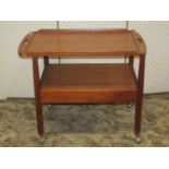 A mid 20th century teak two tier tea trolley of rectangular form with Tingstroms label verso